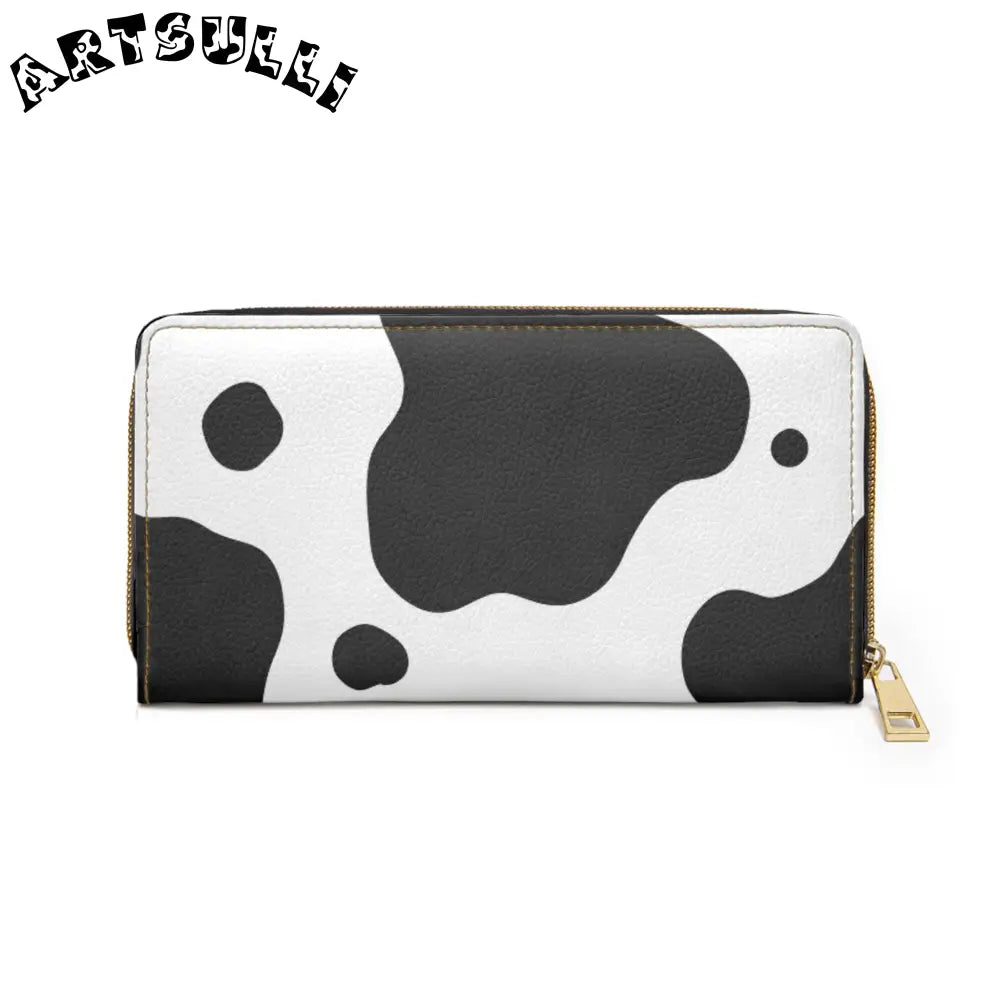 JAKKOUTTHEBXX Cow print zippered wallet displays credit cards with gold hardware 2025